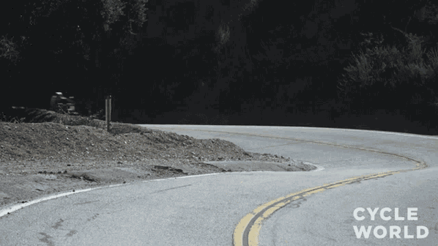 a picture of a road with the words cycle world written on it