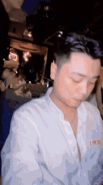 a man wearing a white shirt with a red lettering that says " i love you "