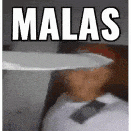 a man is holding a knife in front of his face and the word malas is on the bottom