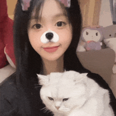 a girl with a cat on her face and a teddy bear nose