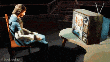 a pixel art of a person sitting in front of a tv with the hashtag @joetastic_