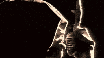 a close up of a man 's face with a shadow on it