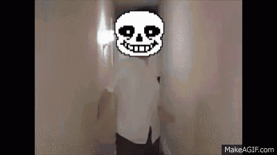 a man in a white shirt is standing in a hallway with a pixelated skull on his head .