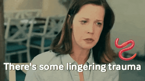 a woman is sitting in a chair with the words " there 's some lingering trauma " on the bottom