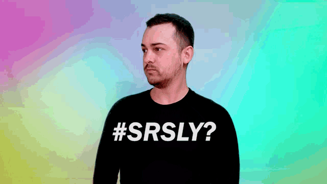 a man wearing a black shirt with #srsly on it