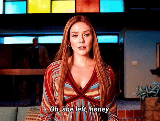 a woman in a striped dress is saying oh she left honey .