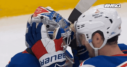 a hockey player wearing a helmet that says benjamin moore on it