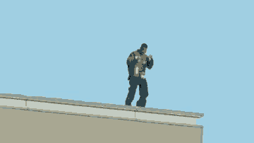 a man is standing on the roof of a building holding a gun .