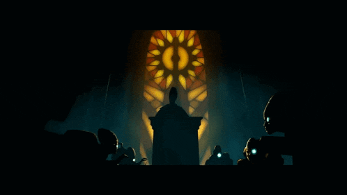 a group of people are standing in front of a podium with a stained glass window behind them