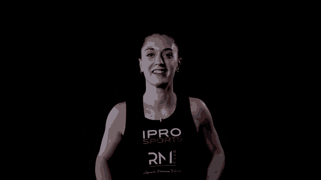 a woman wearing a black tank top that says ipro sports