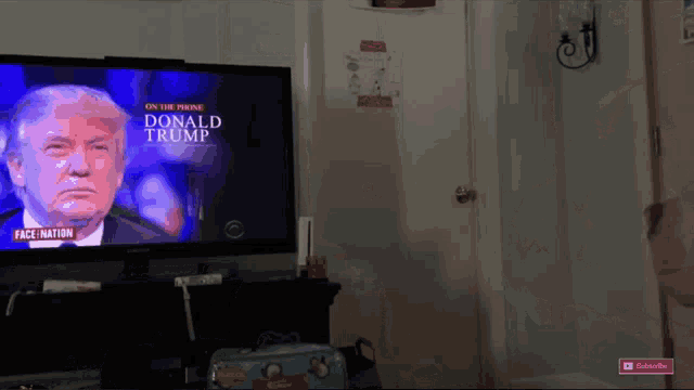a tv screen shows donald trump on the cnn news channel