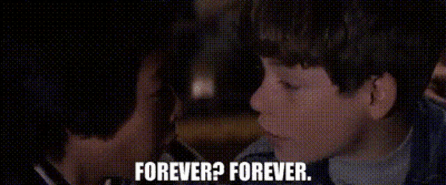 a close up of a boy 's face with the words `` forever ? forever '' written on it .