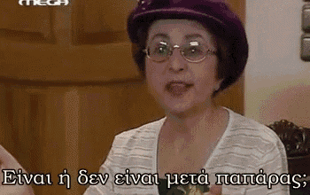 a woman wearing glasses and a purple hat is talking in greek