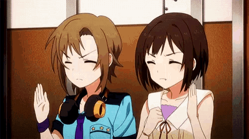 two anime girls are sitting next to each other on a train .