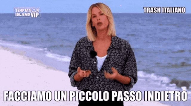 a woman standing on a beach with temptation island vip written on the top