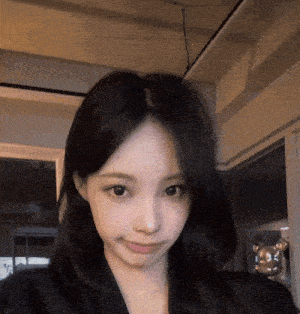 a close up of a woman taking a selfie