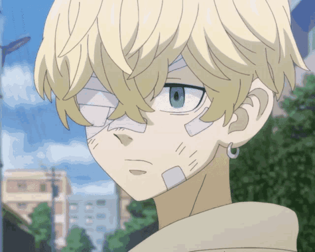 a boy with a bandage on his face looks at the camera