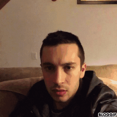 a close up of a man 's face with a bloggif watermark