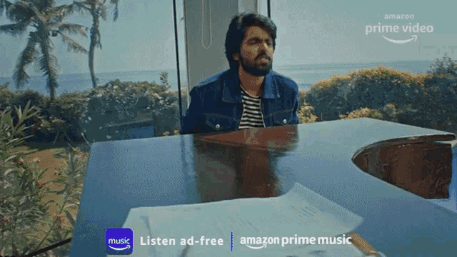 an ad for amazon prime music shows a man sitting at a piano playing