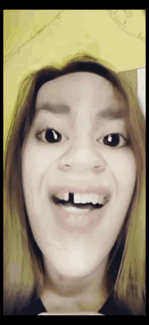 a close up of a woman making a funny face