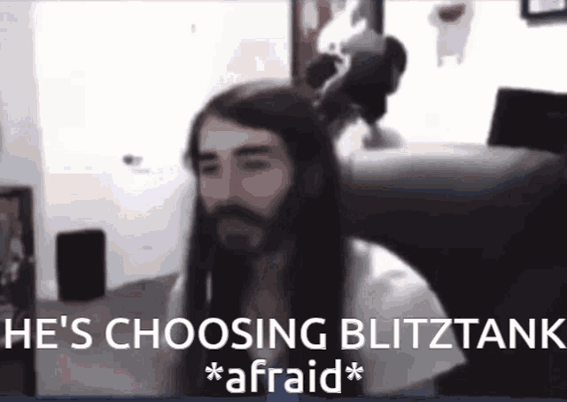 a man with long hair and a beard says he 's choosing blitztank