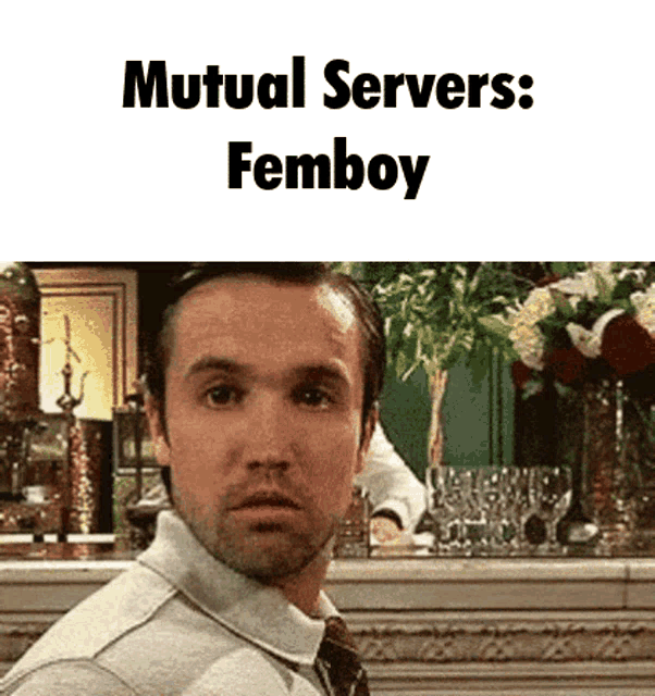 a man in a suit and tie is making a funny face with the words mutual servers femboy above him