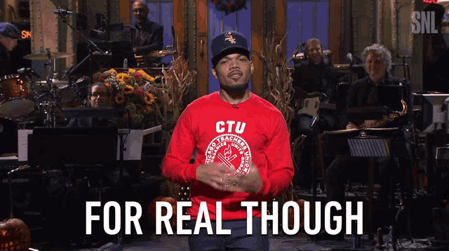 chance the rapper is wearing a red shirt that says ' ctu ' on it
