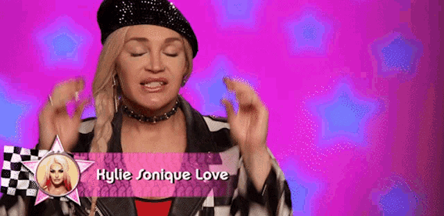 a woman wearing a beret and a jacket with the name hylie jonique love written on it
