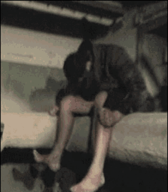 a blurry picture of a person sitting on a couch