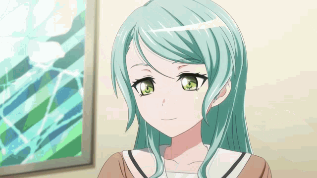a girl with blue hair and green eyes is smiling in front of a picture