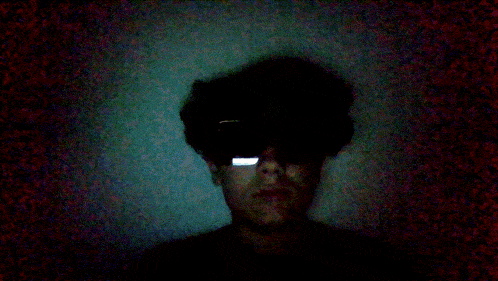 a person wearing a pair of sunglasses with a reflection of a phone