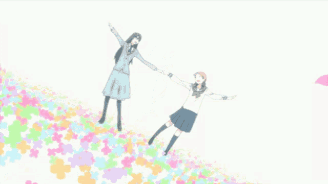 a couple of girls holding hands in a field of flowers