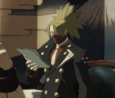 a man in a suit is reading a piece of paper