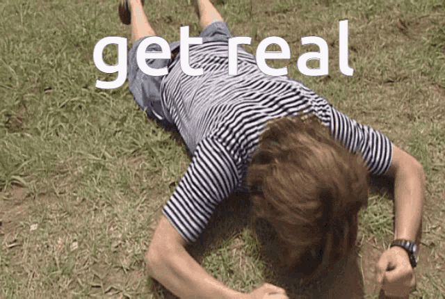 a person laying on the grass with the words get real written above them