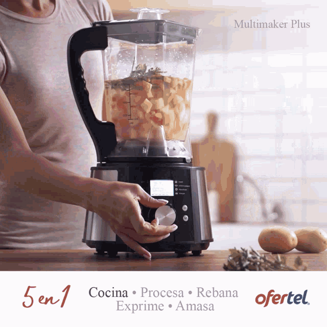 a woman is using a blender that says ofertal on the bottom
