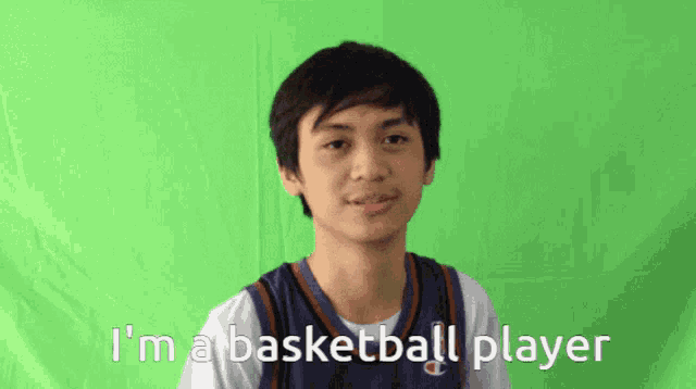 a young man says i 'm a basketball player in front of a green screen