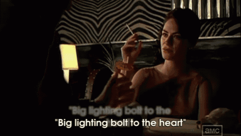 a man says " big lighting bolt to the big lighting bolt to the heart " in a dark room