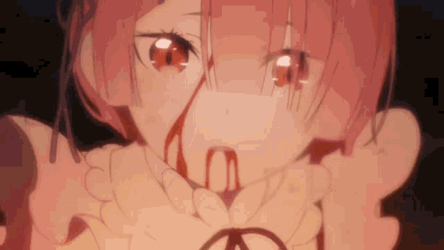 a close up of a girl with blood coming out of her mouth and nose .