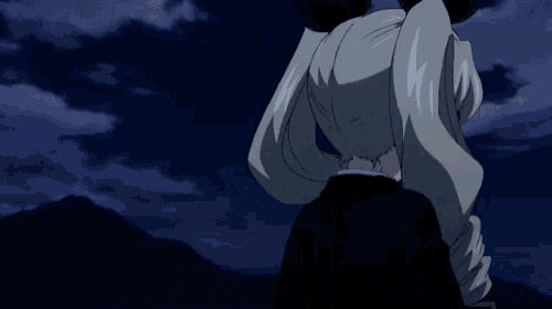 a girl with a bow in her hair is standing in the dark