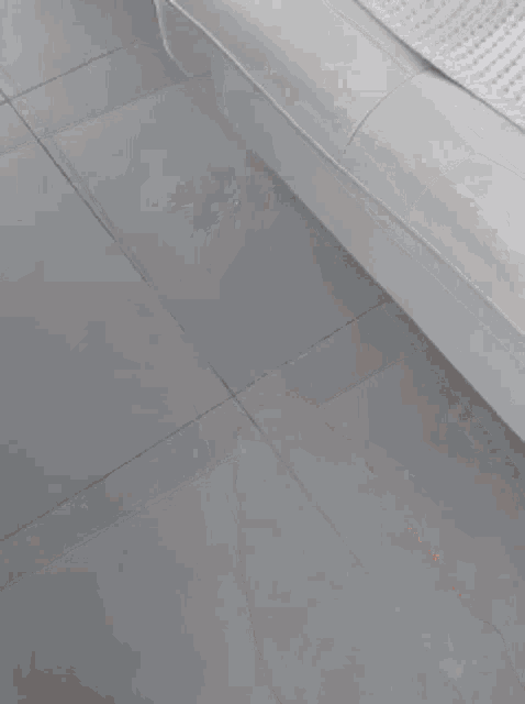 a close up of a person 's hand on the floor