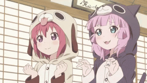 two anime girls wearing dog and cat costumes