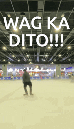 a man ice skating in a large room with the words wag ka dito