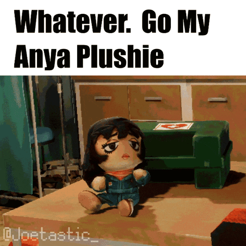 a stuffed anya plushie sits on a wooden table with the caption whatever go my anya plushie