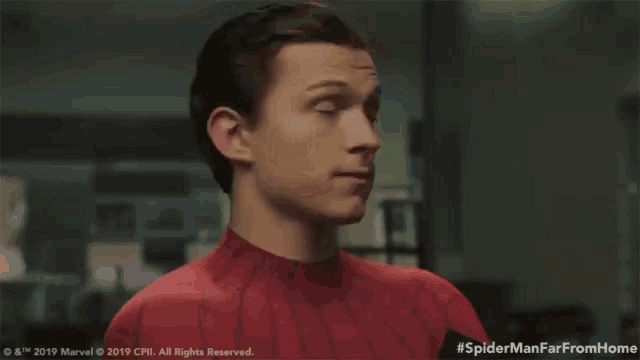 a close up of a man in a spider man suit with the hashtag #spidermanfarfromhome