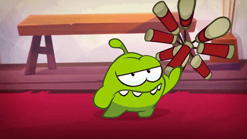 a green cartoon character holding a bunch of red tubes