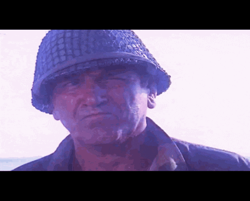 a close up of a man wearing a helmet with the letter a on it