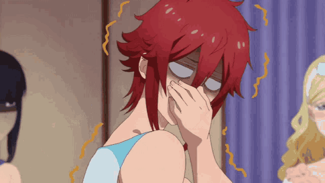 a woman with red hair is covering her nose with her hand