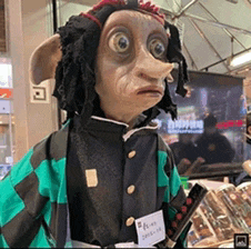 a stuffed animal with big eyes and a name tag that says ' a ' on it