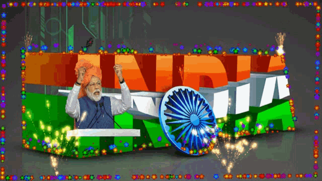 a man in a turban is giving a speech in front of a sign that says india