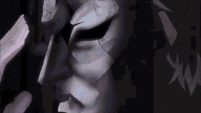 a close up of a person 's face with a broken mask on .